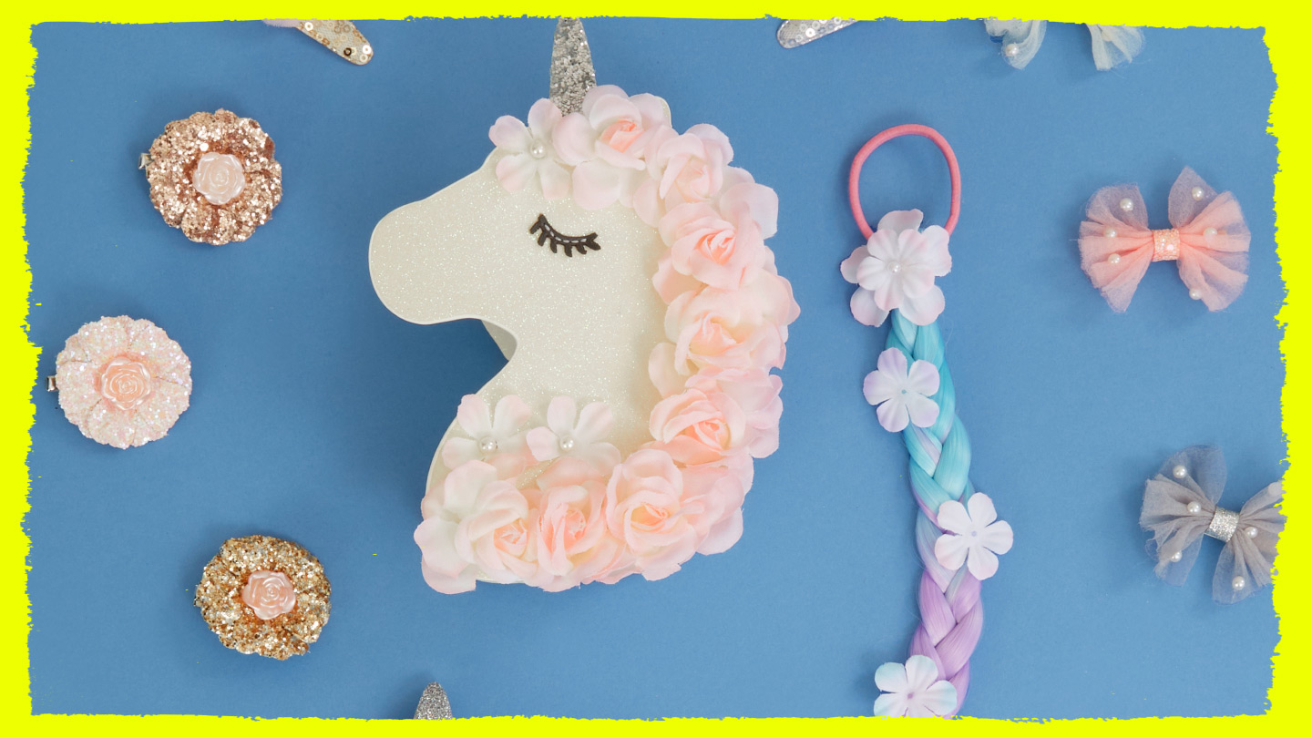 International Unicorn Day, Monsoon unicorn accessories on a blue surface 